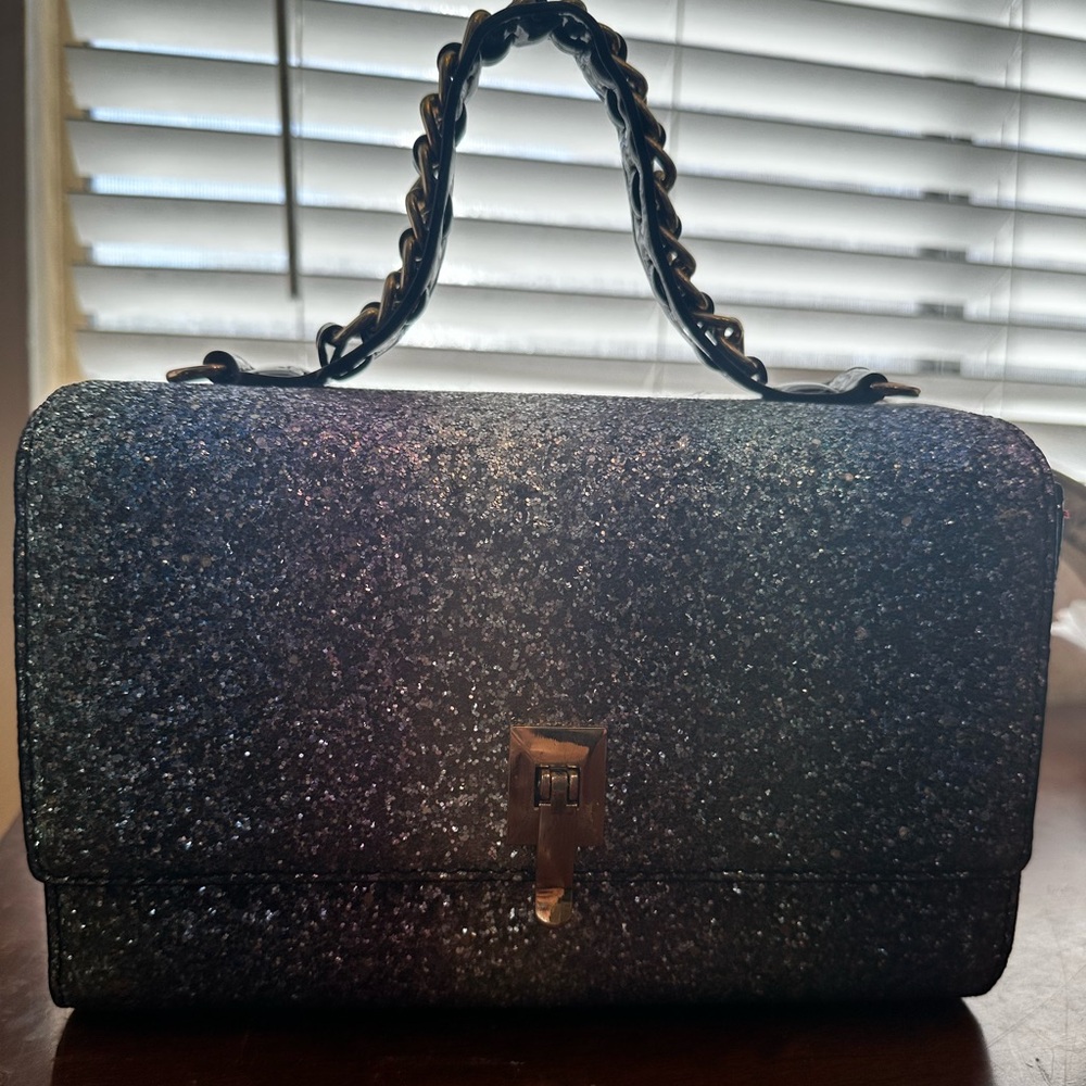Studio 54 glitter and glammer bag with full red insider liner!